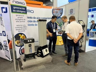 A nano employee speaks to customers during the FABTECH Mexico trade show