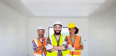 Tradespeople men and woman working in an apartment