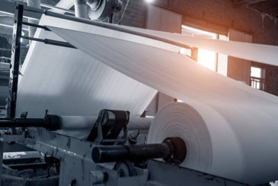 A large roll of paper on a machine