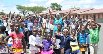 Happy children waving to the camera