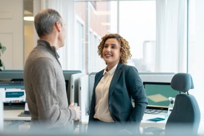 A workplace discussion between  employees. 