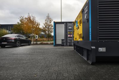 Generator with an energy storage system at a parking lot.