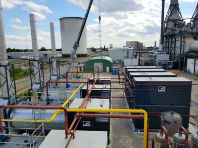 A high-capacity steam generation plant. Multiple boilers and superheaters are interconnected with a network of pipes and valves, demonstrating the scale and complexity of the system.