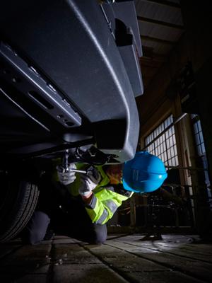 Service technician working on  undercarriage of 8 series compressor
