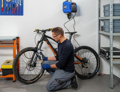 ABAC Tyre inflator. Man Inflating a bike tyre-squared