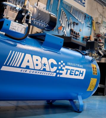 ABAC Tech industrial compressor and pro user portable compressor in workshop 