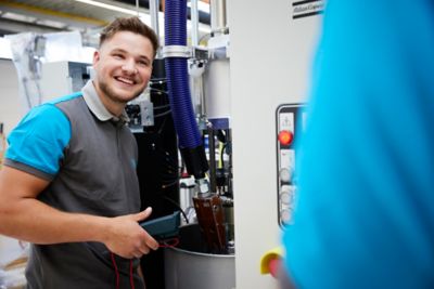 Service Technician performing Machine Capability Analysis on a pump in production