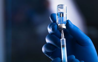 medical hands holds syringe and vaccine