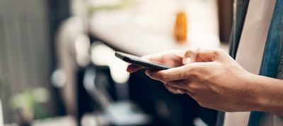 Man using smartphone, During leisure time. The concept of using the phone is essential in everyday life.