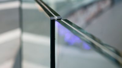 Closeup frameless laminated glass balcony railing.