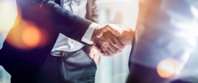 Business Partner Handshake - BeaconMedaes