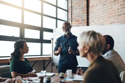 Shot of a businessman giving a presentation to his colleagues in a boardroom