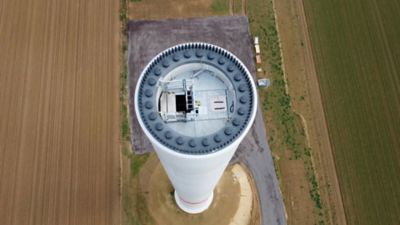 An aerial top view of a wind turbine being built and the bolts are visible