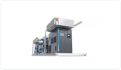 A person using a laptop showing Atlas Copco software