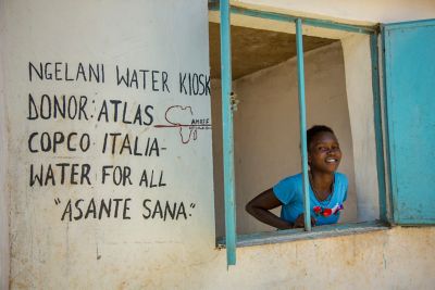 Young women in water kiosk