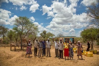 Villagers waving goodbye