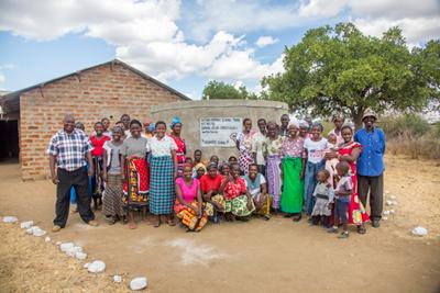 Village representatives by the new water cistern