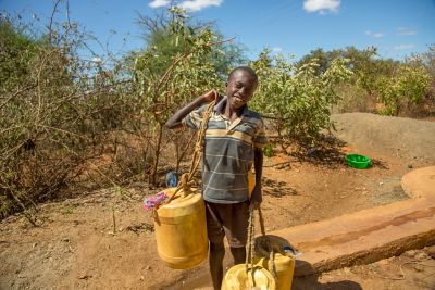 Boy carrying water 