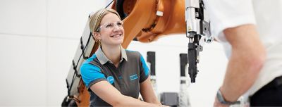 Atlas Copco employee working with an industrial tool