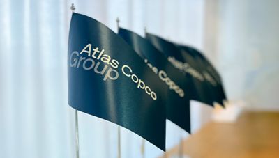 A row of Group flags placed on a table.