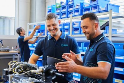 Employees checking equipment in the storage area