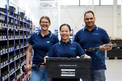 Employees posing with items at the innovation center