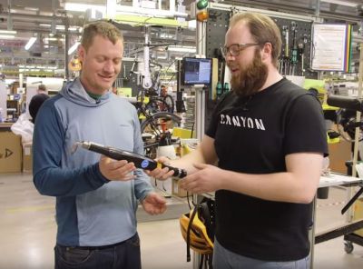 Two operators in Canyon manufacture holding STwrench