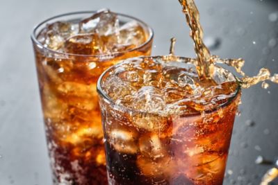 Soft drink being poured into glass