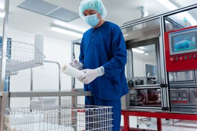 Filtration expert conducting stacker inspection in clean room