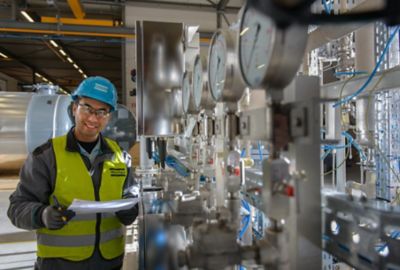 Atlas Copco Compressor Technique service technician in the field.