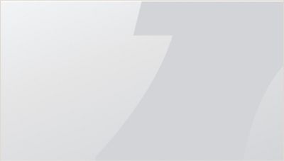 A cutout of the letter "p" from the Atlas Copco logo in grey