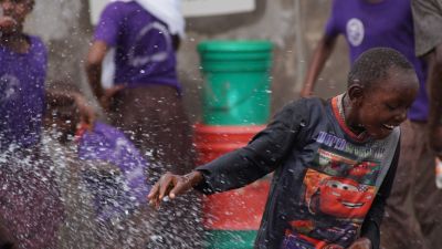 Boy being sprayed with water