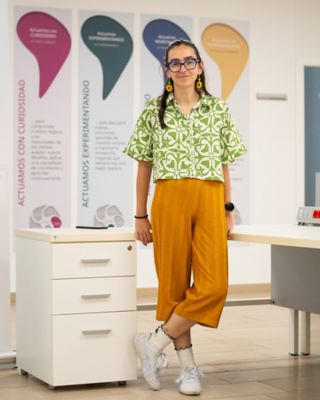 Marta Alonso standing in front of our cultural behaviors