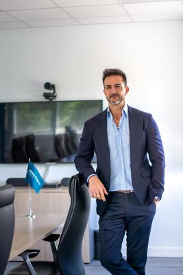 Alfonso Marin Standing in the board meeting room