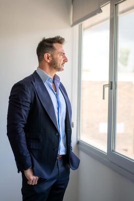 Alfonso Marin looking through the window Photo