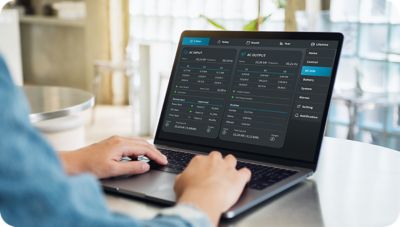 A person using a laptop showing Atlas Copco software