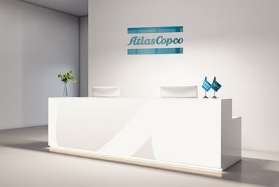 Reception desk with Atlas Copco branding