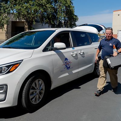 FS Medical technician next to service van.