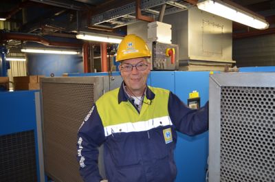 Customer Heerema standing next to compressor