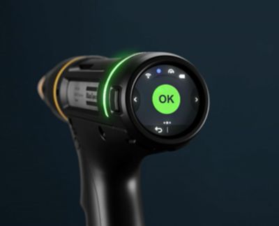 the back of a nut runner with the HMI showing an OK sign for a successful tightening