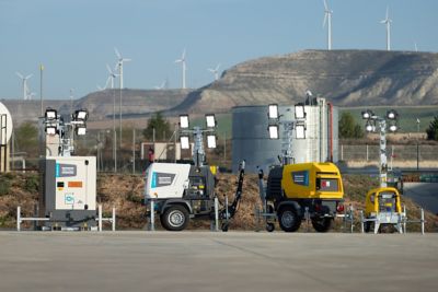 HiLight Light towers range of Atlas Copco on field outside with floodlights on