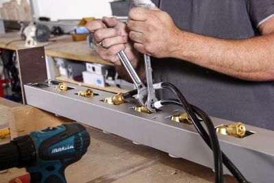 Technician at work replacing and repairing a product.