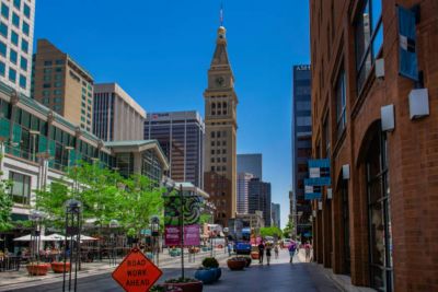 16th Street Mall, a shopping mall in Denver Colorado with Daniels & Fisher Tower on the left side of the road.