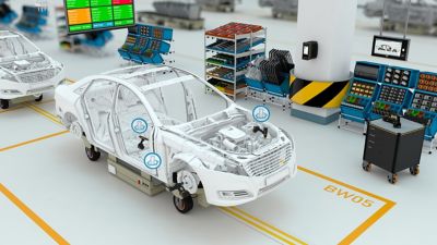 Low reaction tool main picture with car on assembly line