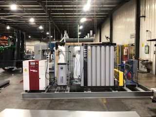 Image of a nano GEN2i4.0 nitrogen gas generator skid with TMC thermal mass refrigerated dryers and receiver