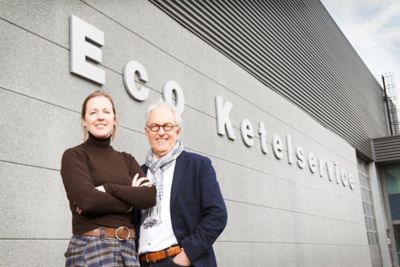Natasja Leijser and Jos Leijser standing in front of the Eco Steam and Heating building.