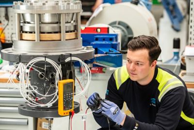 employee checking bearing temperature probe 