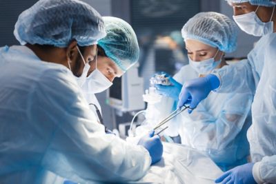 Concentrated Surgical team operating a patient in an operation theater. 