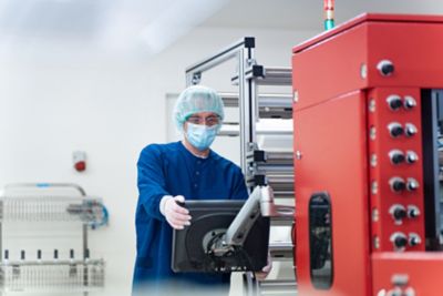 Process filtration expert operating pleating machine in clean room