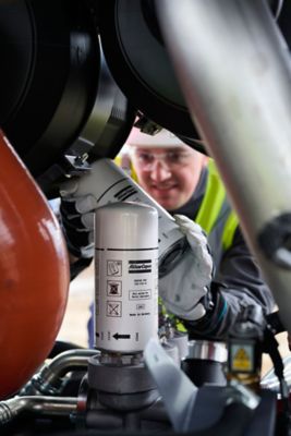 Technician with Next Generation of Genuine Filters